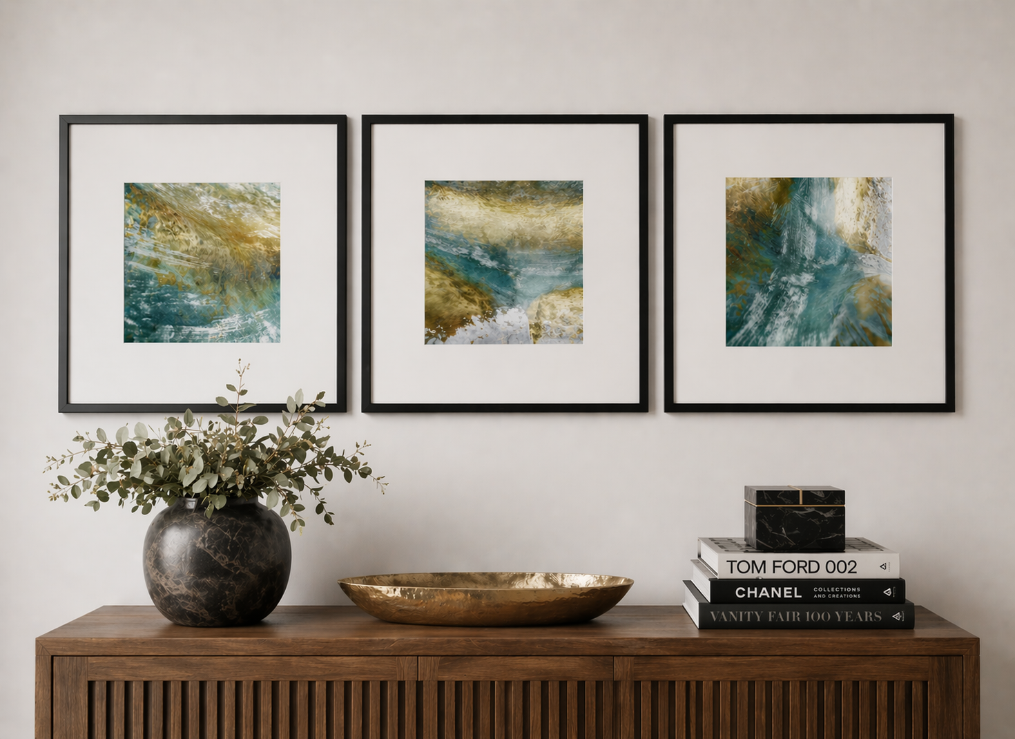 Triptych of framed abstract teal and gold art.